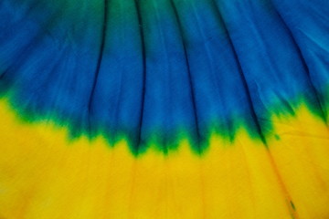 Tie Dye blue and yellow color , abstract texture and background , hippie and reggae style .