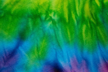 Tie Dye green color , abstract texture and background , reggae style .