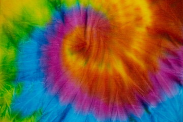Tie Dye spiral rainbow swirl abstract texture and background , reggae style .