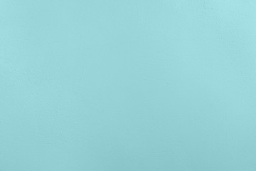 Pale blue colored low contrast Concrete textured background with roughness and irregularities to your concept or product.