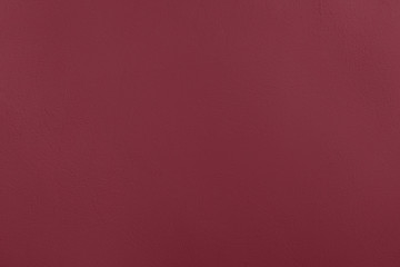 Dark red Concrete textured background to your concept or product. Winter 2020 color trend.