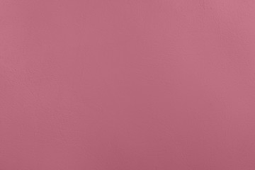 Dark pink colored low contrast Concrete textured background with roughness and irregularities to your concept or product.