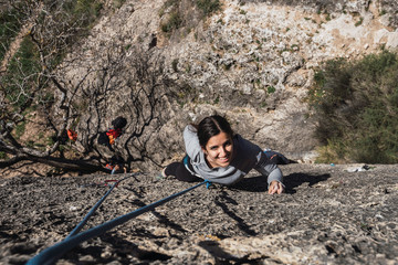 Woman climbing in a wall