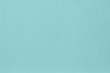 Pale blue colored low contrast Concrete textured background with roughness and irregularities to...