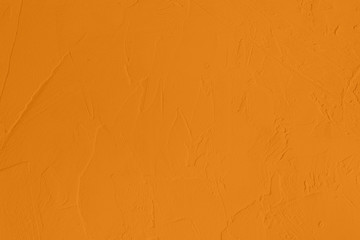 Saturated dark yellow colored low contrast Concrete textured background with roughness and...