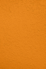 Saturated dark yellow colored low contrast Concrete textured background with roughness and irregularities. Autumn Winter 2020 color trend.