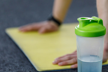 Close up view of athletic man doing exercise at the gym