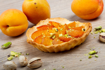 apricot pie just baked on wooden background