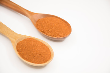 Paprika, ground red peppers on white background.