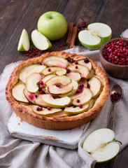 Homemade Apple Pie on rustic background. Classic autumn Thanksgiving dessert.