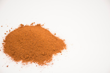 Paprika, ground red peppers on white background.