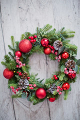 Christmas wreath with red decorations