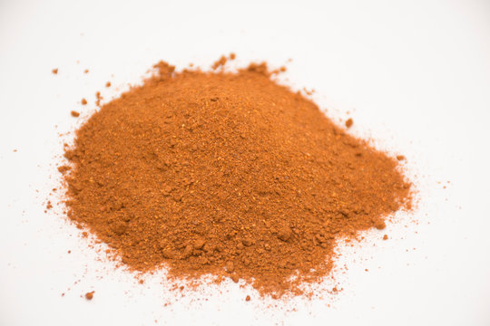 Paprika, ground red peppers on white background.