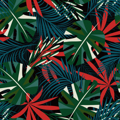 Abstract seamless pattern with colorful tropical leaves and plants on black background. Vector design. Jungle print. Floral background. Printing and textiles. Exotic tropics. Summer.