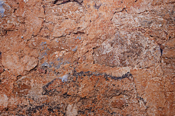 Texture of old concrete wall painted with red paint