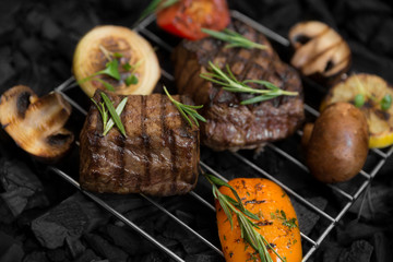 Meat steak with rosemary and mushrooms on grid