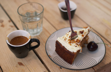 cup of coffee and cake and a glas of water