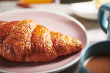Buttery Croissant on Pink Plate 