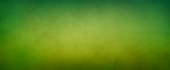 Abstract yellow green background with soft bright gold center glowing with light colors and dark blue green border with blurred mottled texture