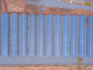 Obraz premium Aerial view of solar panels in factory using clean and renewable energy. Drone shot in the state of Mato Grosso, Brazil. Environment concept, zero carbon emission, clean electricity and future.