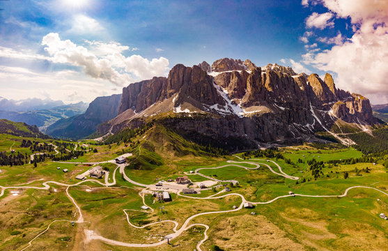 Aerial top view from drone to wonderful alpine landscape and meadows at Pass Gardena with majestic Sella mountain group in Dolomiti. Alps, South Tirol, Dolomites mountains, passo di Val Gardena, Italy