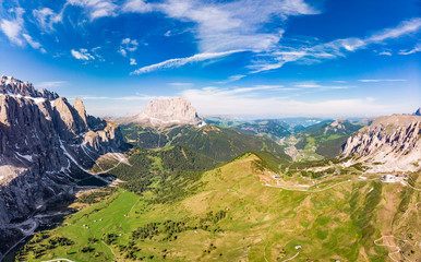 Dolomites - Beautiful panoramic sunset landscape at Gardena Pass, Passo Giau, near Ortisei. Stunning airial view on the top Dolomiti Alps Mountains from drone on summer day, Italy, south Tyrol Europe