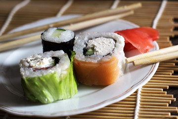 Delicious rolls and ginger on a plate. Traditional Japanese cuisine.