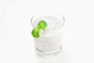 Chia pudding with mint on a white background. Space for text or design.