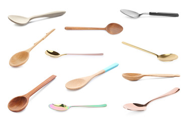 Set of different spoons on white background