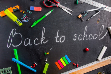Fototapeta na wymiar back to school written on a black chalk black board