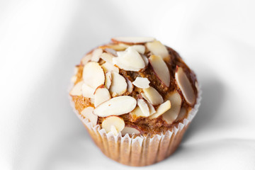 Fresh almond flavored cupcake on a white tablecloth