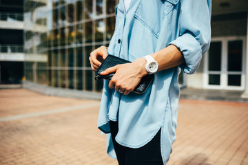 Close-up of young woman dressed in blue denim shirt