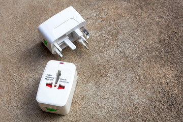 Close up of universal electric socket plug adapters used for travel. Used to connect to different...