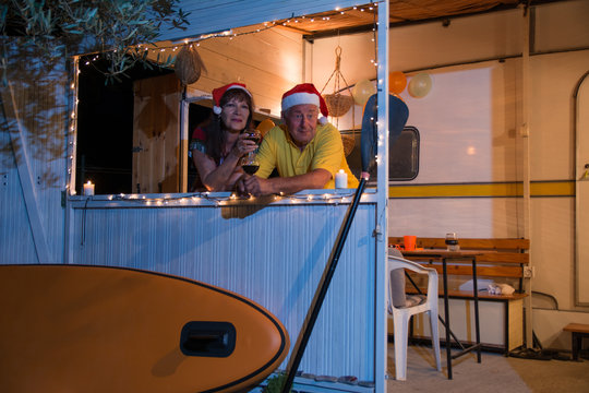 Senior couple on new years evening in their summer home on the beach