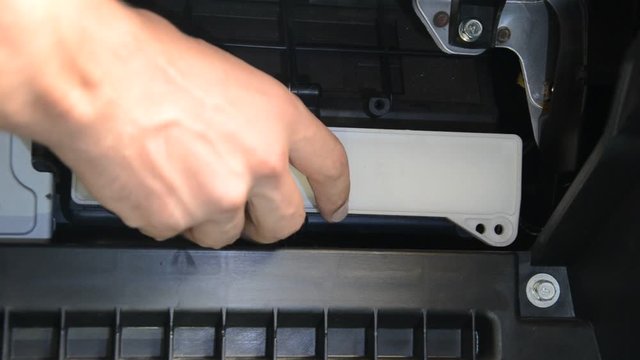 Car repair wizard changes cabin filter in car