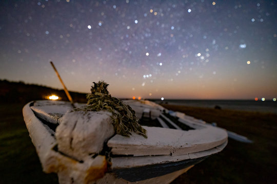Wooden rusty boat under stars