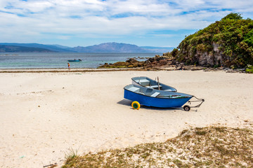 Two amphibious fishing boats on wheels at Langosteira beach in Fisterra, Finisterre or the End of the Earth, in A Coruna, Galicia, Spain on the Way of St. James