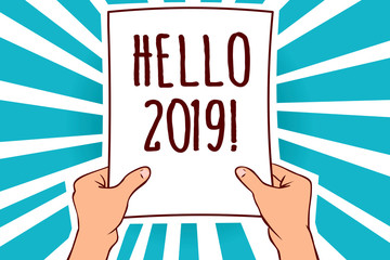 Word writing text Hello 2019. Business concept for expression or gesture of greeting answering the telephone Man holding paper important message remarkable blue rays enlighten ideas