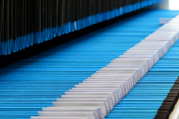 Blue and White Medical Files In Open Cabinet with empty name tags.