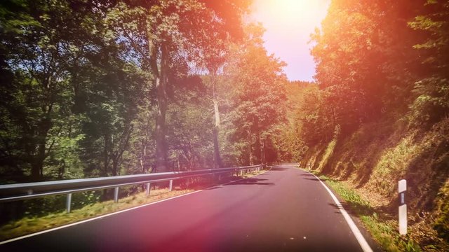 POV footage of driving down a rural road, 4K