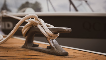 docked boat tied with nautical rope and knot - obrazy, fototapety, plakaty