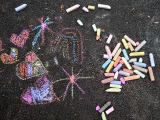 street chalk abstract sketch on a freshly blacktopped driveway