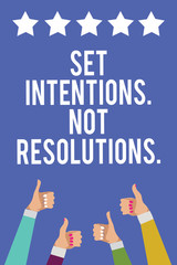 Text sign showing Set Intentions. Not Resolutions.. Conceptual photo Positive choices for new start achieve goals Men women hands thumbs up approval five stars information blue background