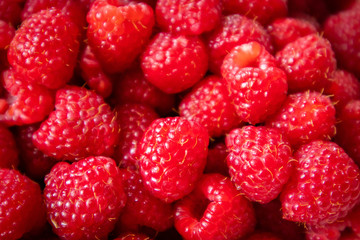 Fresh raw organic raspberries on a plate