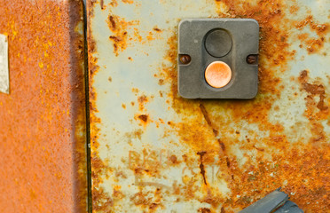 old switch on a rusty metal electrical panel