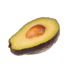 half of black avocado with stone isolated on white background
