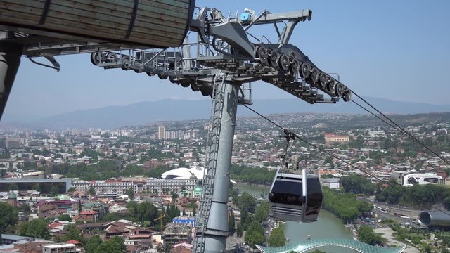 Cableway with cable car over the most famous Narikala Fortress and Peace bridge. Tbilisi, Georgia.