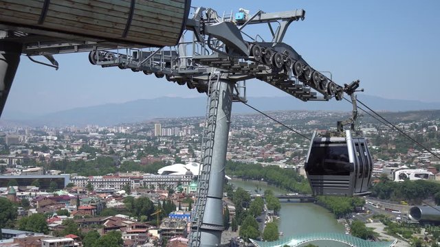 Cableway with cable car over the most famous Narikala Fortress and Peace bridge. Tbilisi, Georgia.