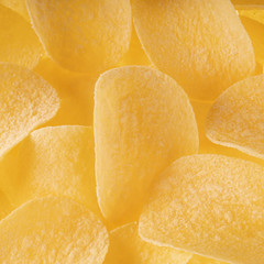 fresh potato chips background. top view