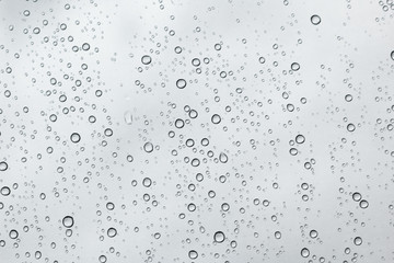Fototapeta na wymiar Water drops on car glass.rain drops on clear window